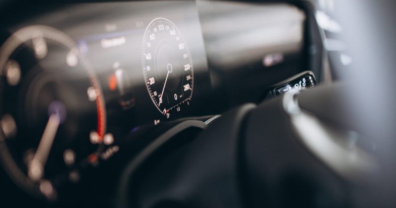 Car dashboard and wheel close up